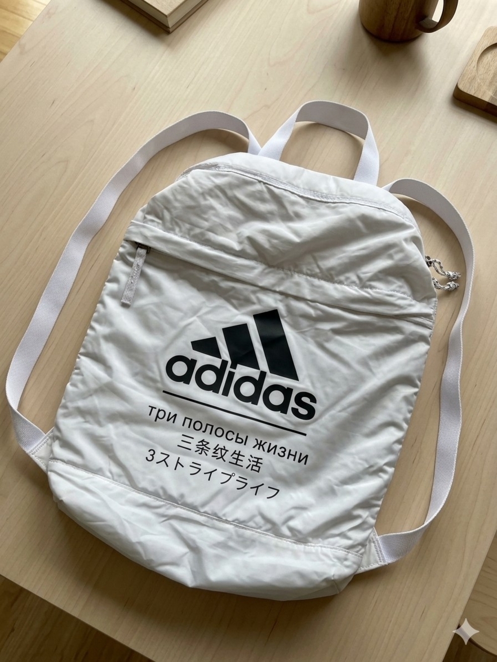 adidas White Backpack with Black Logo and Text